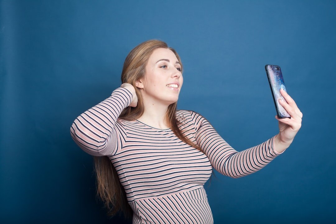 Studio portrait of a young woman specialised in social video
